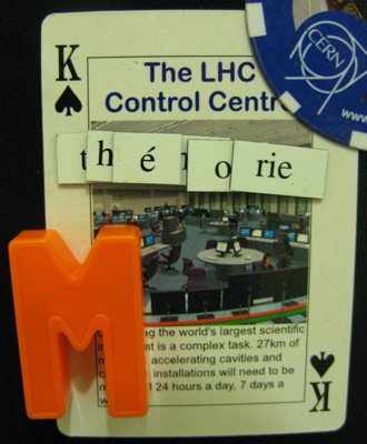King of Spades featuring The LHC Control Centre, and magnets saying \'théorie M\'
