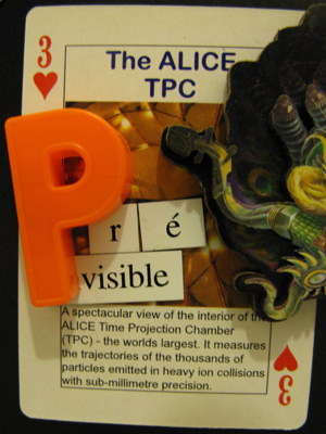 Three of hearts showing the ALICE TPC, with tentacle monster and the word \'Prévisible\'. A spectacular view of the interior of the ALICE Time Projection Chamber (TPC) - the world\'s largest. It measures the trajectories of the thousands of particles emitted in heavy ion collisions with sub-millimetre precision.