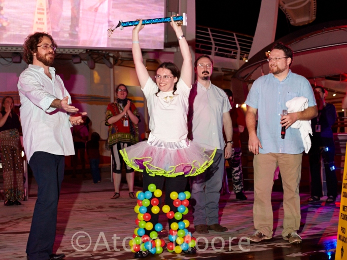 I hold the trophy high, while Jonathan Coulton gestures towards my pants